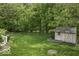 Spacious backyard featuring a charming shed, lush lawn and mature trees at 1119 Albemarle Cir, Noblesville, IN 46062