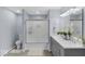 Bathroom features grey double vanity, glass-enclosed shower, and neutral colored walls at 1119 Albemarle Cir, Noblesville, IN 46062