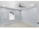 Well-lit carpeted bedroom featuring a ceiling fan and a window at 1119 Albemarle Cir, Noblesville, IN 46062