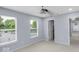 Bright bedroom featuring two windows overlooking the neighborhood at 1119 Albemarle Cir, Noblesville, IN 46062