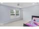 Cozy bedroom with a fan and two windows providing natural light at 1119 Albemarle Cir, Noblesville, IN 46062