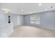Well-lit bonus room offers neutral carpeting, recessed lights, and blue walls at 1119 Albemarle Cir, Noblesville, IN 46062