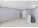 Bright, airy bonus room has neutral carpet, recessed lighting, and blue walls at 1119 Albemarle Cir, Noblesville, IN 46062