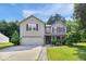 Charming two-story home features a well-manicured lawn and attached two car garage at 1119 Albemarle Cir, Noblesville, IN 46062