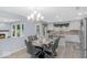 Bright eat-in kitchen with stainless appliances, island, and large window at 1119 Albemarle Cir, Noblesville, IN 46062