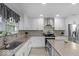 Well-lit kitchen features granite countertops and stainless steel appliances at 1119 Albemarle Cir, Noblesville, IN 46062