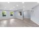 Bright and airy living room with wood-look flooring and plenty of natural light at 1119 Albemarle Cir, Noblesville, IN 46062