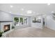 Living room with fireplace and large windows that provide outdoor views at 1119 Albemarle Cir, Noblesville, IN 46062