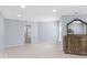 Spacious main bedroom suite with neutral carpet, blue walls, and traditional wood furniture at 1119 Albemarle Cir, Noblesville, IN 46062