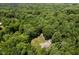 An aerial view of a home surrounded by trees, offering a private and serene setting at 1125 Observatory Rd, Martinsville, IN 46151