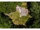 Aerial view of home with a large grassy yard surrounded by mature trees offering privacy at 1125 Observatory Rd, Martinsville, IN 46151