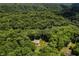 An aerial view of a home in a lush, green, tree-filled, and private location at 1125 Observatory Rd, Martinsville, IN 46151