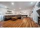 Spacious basement with wood floors, comfy seating, and a pool table at 1125 Observatory Rd, Martinsville, IN 46151