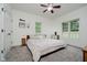 This bedroom features two bright windows, neutral paint and carpet, and a ceiling fan at 1125 Observatory Rd, Martinsville, IN 46151
