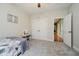 Bedroom featuring soft carpet, natural light, neutral paint, and closet access at 1125 Observatory Rd, Martinsville, IN 46151