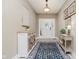 A welcoming entryway with a decorative rug and a view of the front door and tasteful decor at 1125 Observatory Rd, Martinsville, IN 46151