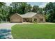 Beautiful brick home featuring an attached garage and a well-manicured lawn surrounded by mature trees at 1125 Observatory Rd, Martinsville, IN 46151