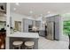 Spacious kitchen with grey cabinetry, stainless steel appliances, quartz countertops, and breakfast bar at 1125 Observatory Rd, Martinsville, IN 46151