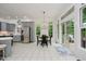 Bright kitchen area with stainless steel appliances, a dining table, and sliding glass doors at 1125 Observatory Rd, Martinsville, IN 46151