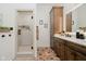 Elegant main bathroom with glass enclosed shower, tile floors, and wood vanity with double sinks at 1125 Observatory Rd, Martinsville, IN 46151