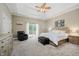Bright main bedroom features tray ceilings, and outdoor access to a private balcony at 1125 Observatory Rd, Martinsville, IN 46151