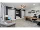 Well-lit office with two closets, gray accent wall, and neutral carpet, plus ample space for desk and seating at 1125 Observatory Rd, Martinsville, IN 46151