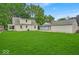 The expansive green backyard connects the home to additional structures on the property at 1149 E 56Th St, Indianapolis, IN 46220