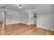 Bright bedroom featuring wood floors, a cozy light fixture, and built-in storage at 1149 E 56Th St, Indianapolis, IN 46220