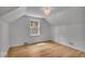 Bright bedroom featuring wood floors, natural light, and a modern light fixture at 1149 E 56Th St, Indianapolis, IN 46220