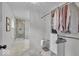Spacious walk-in closet with tile floors, built-in storage, and access to walk-in shower at 1149 E 56Th St, Indianapolis, IN 46220