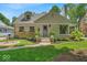Charming home with a manicured front lawn, flower boxes and a cozy brick pathway at 1149 E 56Th St, Indianapolis, IN 46220
