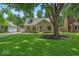 Charming home with a lush green lawn and beautiful trees at 1149 E 56Th St, Indianapolis, IN 46220