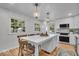 Bright eat-in kitchen with backyard view, large island with seating, and stainless steel appliances at 1149 E 56Th St, Indianapolis, IN 46220