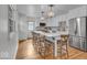 Modern kitchen with a large center island, stainless steel appliances, and hardwood floors at 1149 E 56Th St, Indianapolis, IN 46220