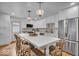 Modern kitchen featuring a large island, white cabinets, and stainless steel appliances at 1149 E 56Th St, Indianapolis, IN 46220