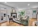 Bright and stylish living room with hardwood floors, a fireplace and chic furnishings at 1149 E 56Th St, Indianapolis, IN 46220