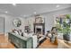 Stylish living room featuring a fireplace, hardwood floors, and designer furnishings at 1149 E 56Th St, Indianapolis, IN 46220