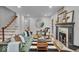 Inviting living room boasting hardwood floors, an elegant fireplace, and chic decor at 1149 E 56Th St, Indianapolis, IN 46220