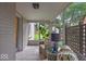Cozy screened porch with patterned tile, comfortable seating, and garden view at 1149 E 56Th St, Indianapolis, IN 46220