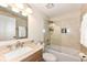 Bathroom featuring a bathtub with a shower, large mirror, and single sink vanity at 12020 Colbarn Dr, Fishers, IN 46038
