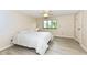 A well-lit bedroom with neutral walls, a large bed, and a ceiling fan at 12020 Colbarn Dr, Fishers, IN 46038