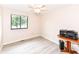 Spare bedroom with a window looking out onto the front yard and a ceiling fan at 12020 Colbarn Dr, Fishers, IN 46038