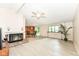 Spacious living room featuring a fireplace, wood floors, and airy ambiance at 12020 Colbarn Dr, Fishers, IN 46038