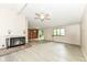 Bright, open living area with fireplace, built-in shelving, and access to a patio at 12020 Colbarn Dr, Fishers, IN 46038