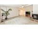 Cozy living area with a fireplace, hardwood floors, and ample natural light at 12020 Colbarn Dr, Fishers, IN 46038