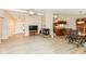 Open-concept living space with fireplace, hardwood floors, and natural light at 12020 Colbarn Dr, Fishers, IN 46038