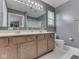 Bathroom featuring double sink vanity, large mirror, and a shower over bath at 1225 Berrywood Dr, Greenwood, IN 46143