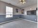 Bedroom with a window, gray carpet, and blue and gray wainscoting at 1225 Berrywood Dr, Greenwood, IN 46143