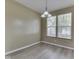 Dining area features a modern chandelier and natural light from the window at 1225 Berrywood Dr, Greenwood, IN 46143