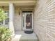 Close-up of the front door with brick facade and welcoming entrance at 1225 Berrywood Dr, Greenwood, IN 46143
